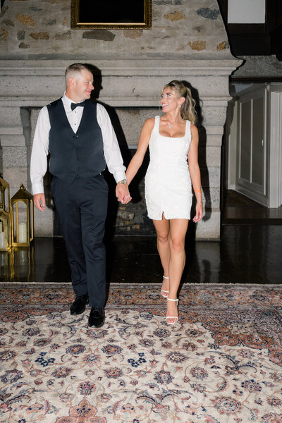 Wedding Photographer in Newport, RI, CT, and beyond | The Corteses | Bride and groom looking at wach other as there walking