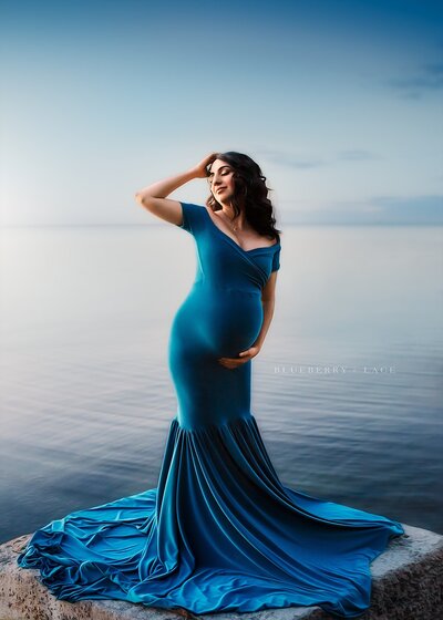 lake ontario in oswego ny photographing mama wearing a blue dress elegant and beautiful