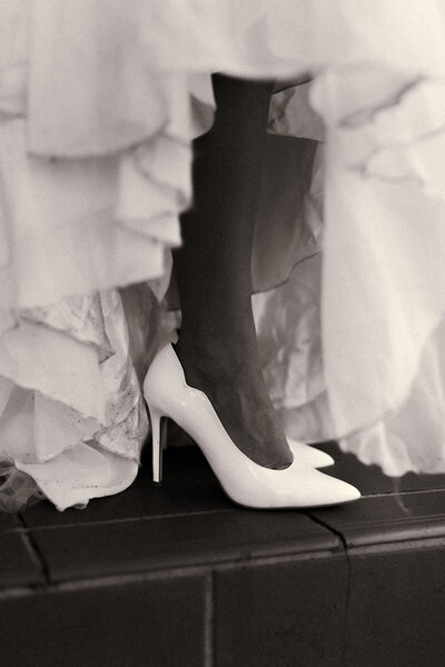 A timeless wedding portrait captured on a brides shoes and dress in BOP by Eilish Burt