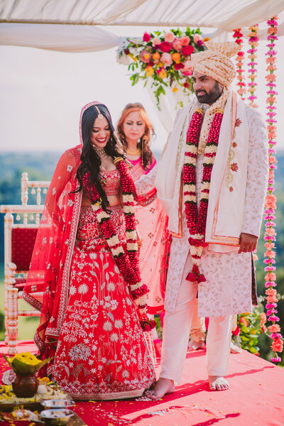 A bride and groom during their indian hindu wedding ceremony at the natirar mansion