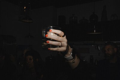 Guest toasting the bride and groom at an intimate downtown Providence wedding. Photography by Rhode Tripper Photography