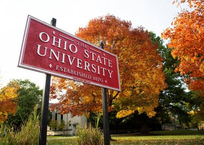 Red sign that says The Ohio State University on the campus of OSU