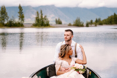 bride and groom sitting in a boat