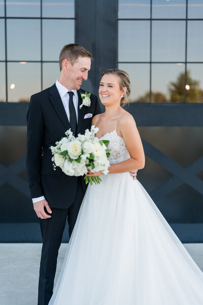 Bride and groom kiss at Old Homestead Farm in NC.