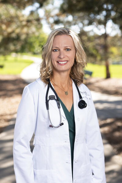 Dr. Nicole Dorotik MD headshot in white coat