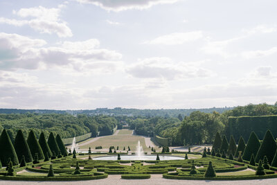 landscape image of pine trees surrounding the Chateau-Du-Sceaux in Paris