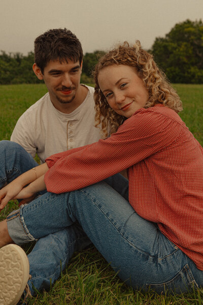 A young couple at their picnic engagement photoshoot in Friendswood, TX