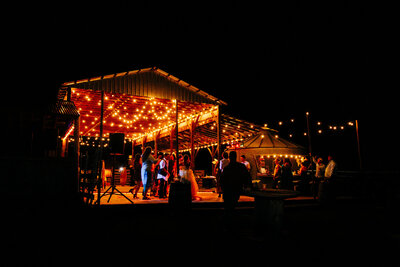Cattle Springs wedding reception barn lights at night