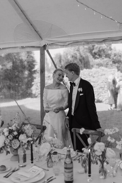 Wedding photographer captures couple taking a stroll hand in hand at their french chateau wedding.