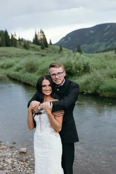 Intimate moment between bride and groom outdoors, showcasing Ryann B Photography’s personalized wedding packages in Indiana.