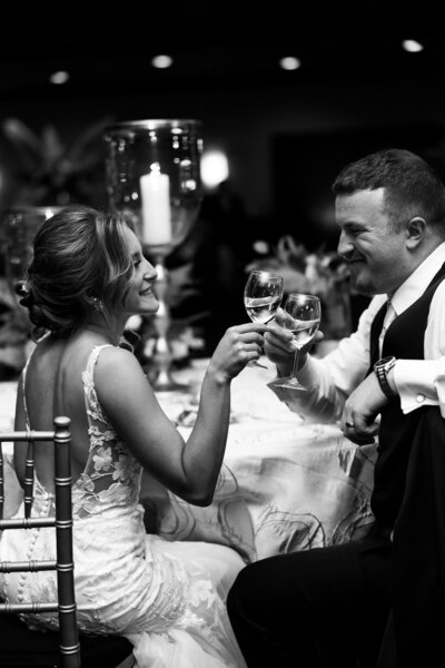 bride and groom sitting in coffee shop