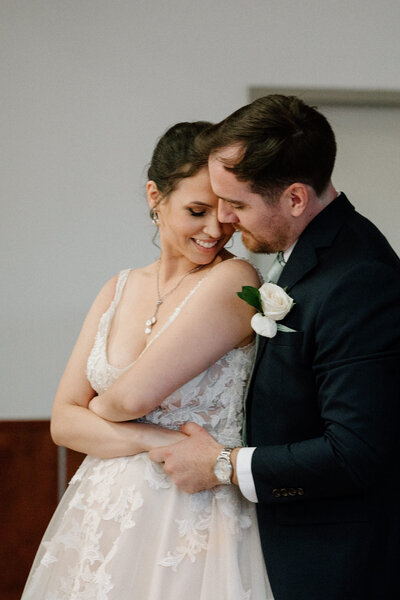 A hug shared by the bride and groom for their first dance at the reception