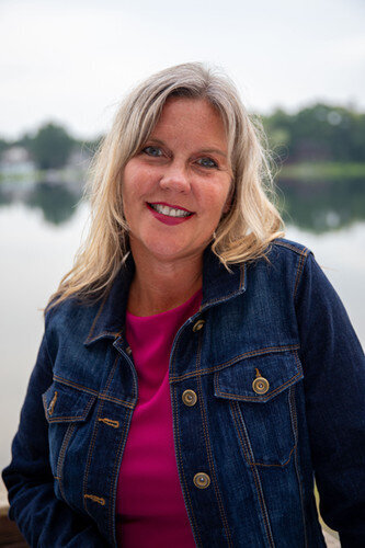 Jen Todd in jean jacket, pink shirt
