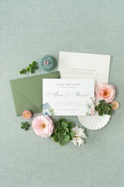 Neutral wedding invitation with watercolor olives,  neutral tan envelope, address printing, and vintage postage stamps