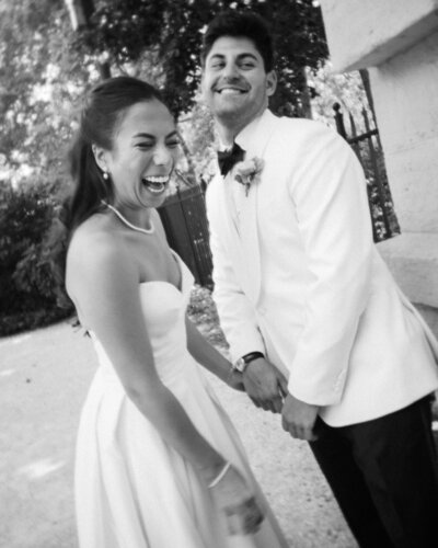 Bride and groom laugh at Rodin Museum