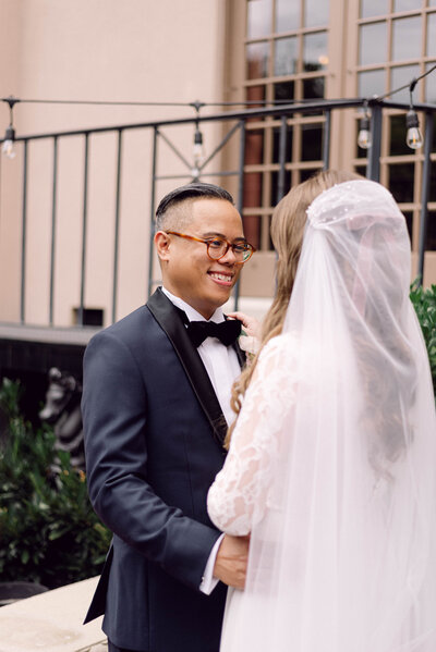 Groom holding the bride’s waist while gazing at her lovingly during their Richmond, VA wedding