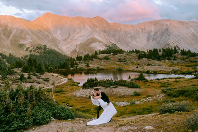 Bride and groom feeding eachother cake during their Colorado elopement at Garden of the Gods
