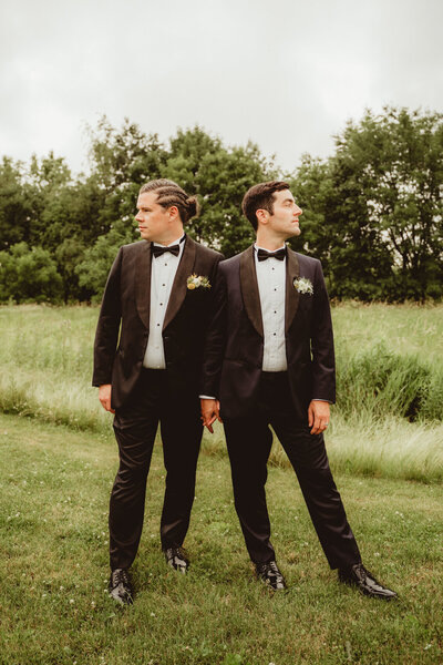 groom and groom striking a pose at barnwood events in madison, winconsin.