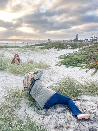 portrait photographer in sand dunes with client