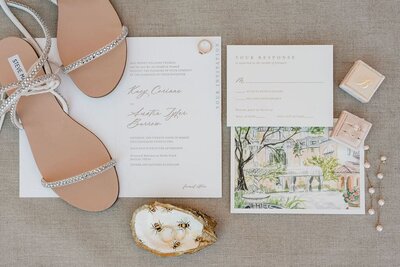 Romantic wedding invitations with sparkly sandals and rustic elements
