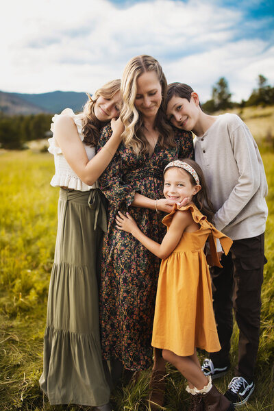 Picture of mom who is a photographer with her 3 children