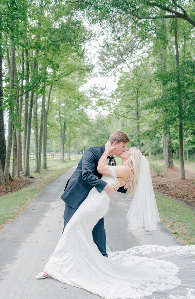 Bride and groom kiss at Old Homestead Farm in NC.