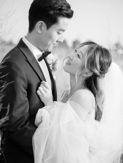 Fine art detail shot of bridal fashion featuring elegant textured sleeve in soft light