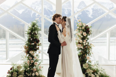 Couple kissing after saying I Do at the Gem Event Centre in Canmore