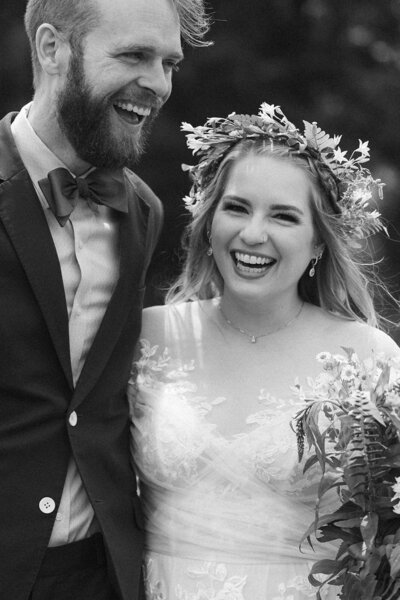 a black and white image of champagne flutes and wedding day Polaroids