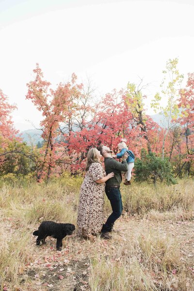 family with their dog takes family portraits