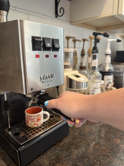An iPhone image of photographer heidi iliff making a shot of espresso