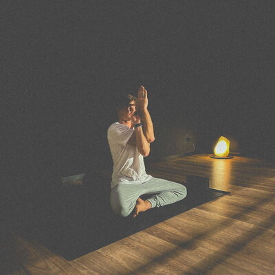 meditation class in dark yoga studio