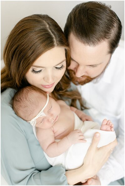 Details show of baby snuggled in wrap