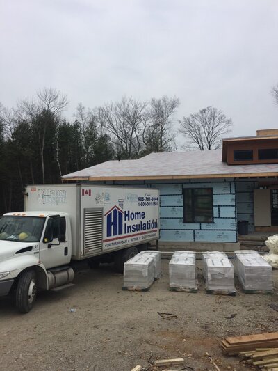 Home insulation truck parked in front of home