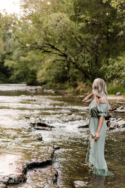 woman standing in creek