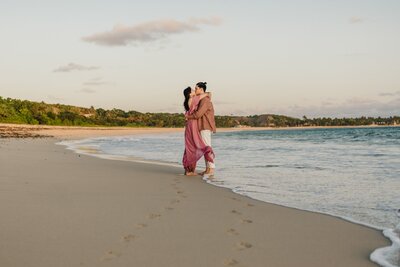 couple kissing on beach