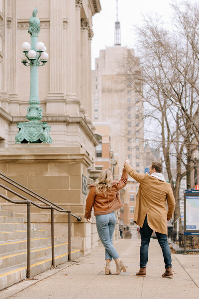 couple dancing on sidewalk
