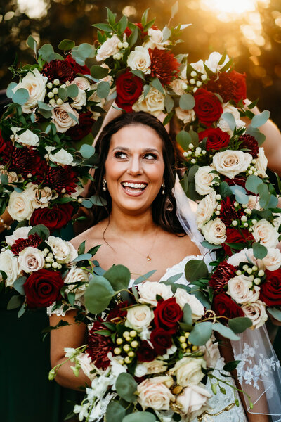 fun bride pose with flower frame at sunset in rip van winkle gardens new Iberia, la