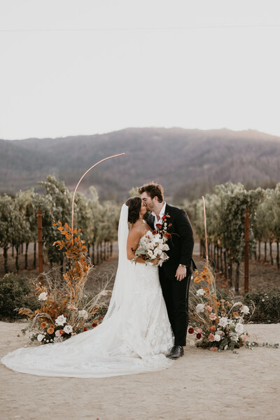 bridal couple hiking with backpacks