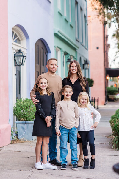 mom and dad and three kids in downtown Charleston, taken by Bruna Firkins Photography