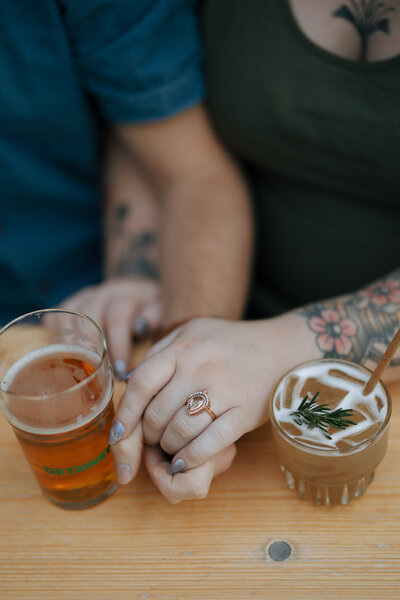 Engagement ring shot with drinks at Seventh Son Brewery in Columbus, Ohio by April Graber Photography 