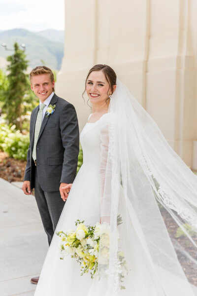 bride and groom wedding portraits payson utah temple at sunset