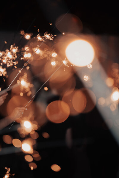 Close-up of sparklers at night during wedding exit