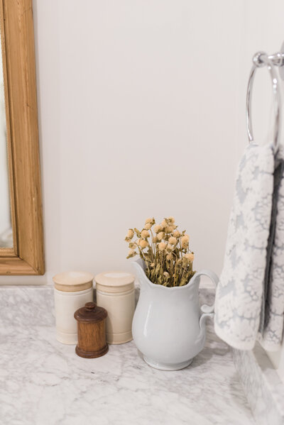 pharmacy jars and accessories on bathroom vanity