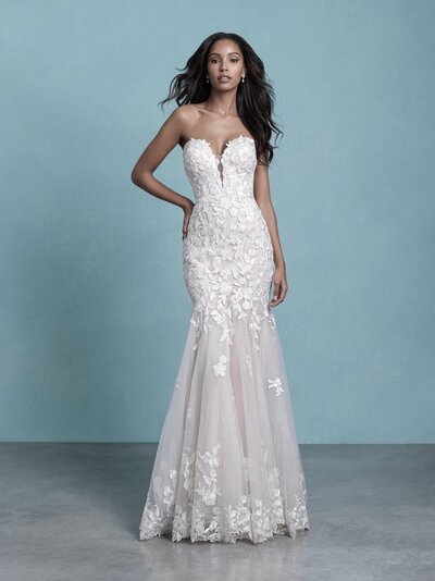 Textured lace blooms and leaves are scattered across this strapless gown.