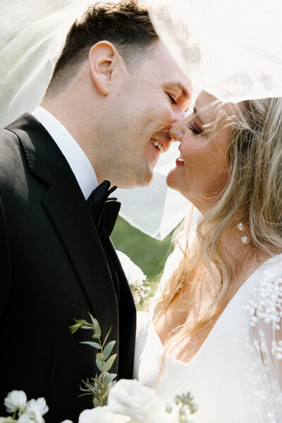 A kiss shared between a wedded couple captured by Ottawa Gatineau wedding photographer, Valerie Doucette