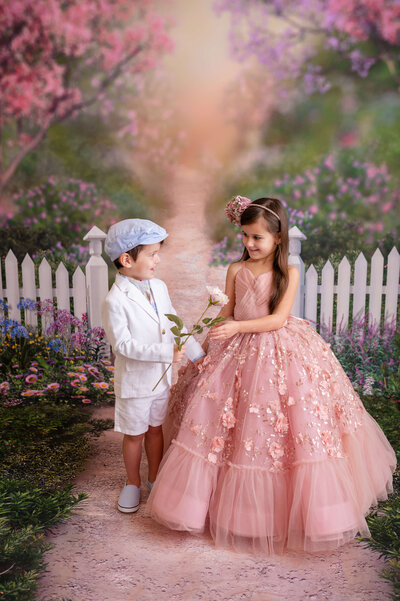 Girl in a pink Dollcake dress with a unicorn in pink flowers
