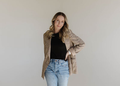 Photographer walking in front of wall
