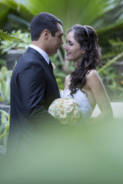 Experience romantic wedding photography amidst lush gardens at Villa Botanica, Whitsundays.