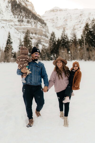 family walking together in the snow at Sundance Mountain Resort in Provo, Utah